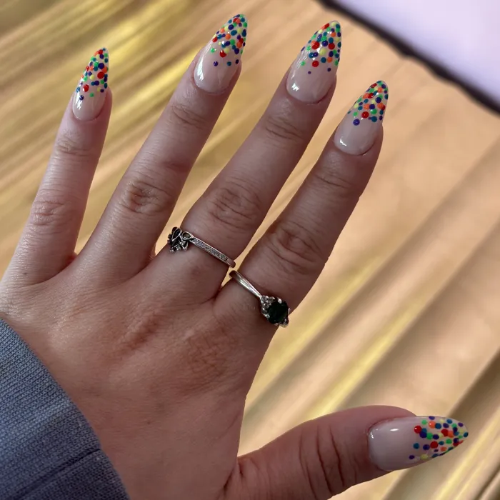 Long almond nails with multicolor polka-dot tips